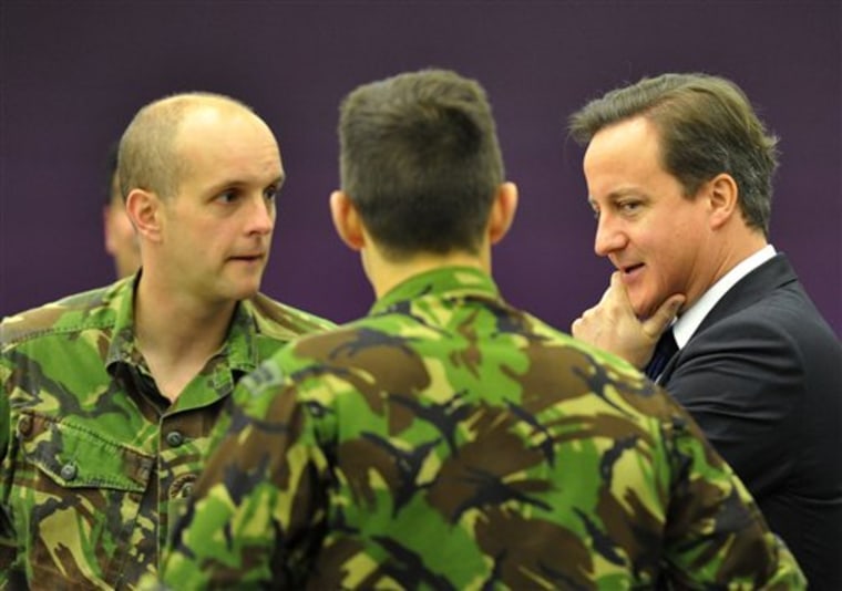 Britain's Prime Minister David Cameron visits The Permanent Joint Headquarters in Northwood near London on Tuesday Oct. 19, 2010. Britain will lose thousands of troops, slash weapons programs and likely delay a major project to upgrade its nuclear-armed submarine fleet after a review of defense spending.